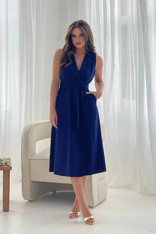 Midi dresses with ruffled sleeves for a more feminine and voluminous look Callie Linen Blend Sleeveless Tie Front Midi dress Navy Midi dresses with ruffled sleeves for a more feminine and voluminous look Callie Linen Blend Sleeveless Tie Front Midi dress Navy