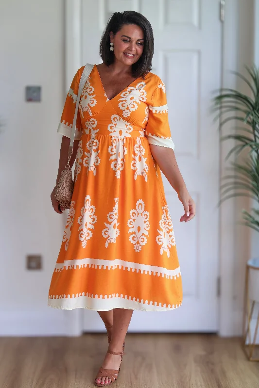 Midi dresses with wrap - around skirts for a customizable fit Suzanne Orange Boarder Midi Dress Midi dresses with wrap - around skirts for a customizable fit Suzanne Orange Boarder Midi Dress