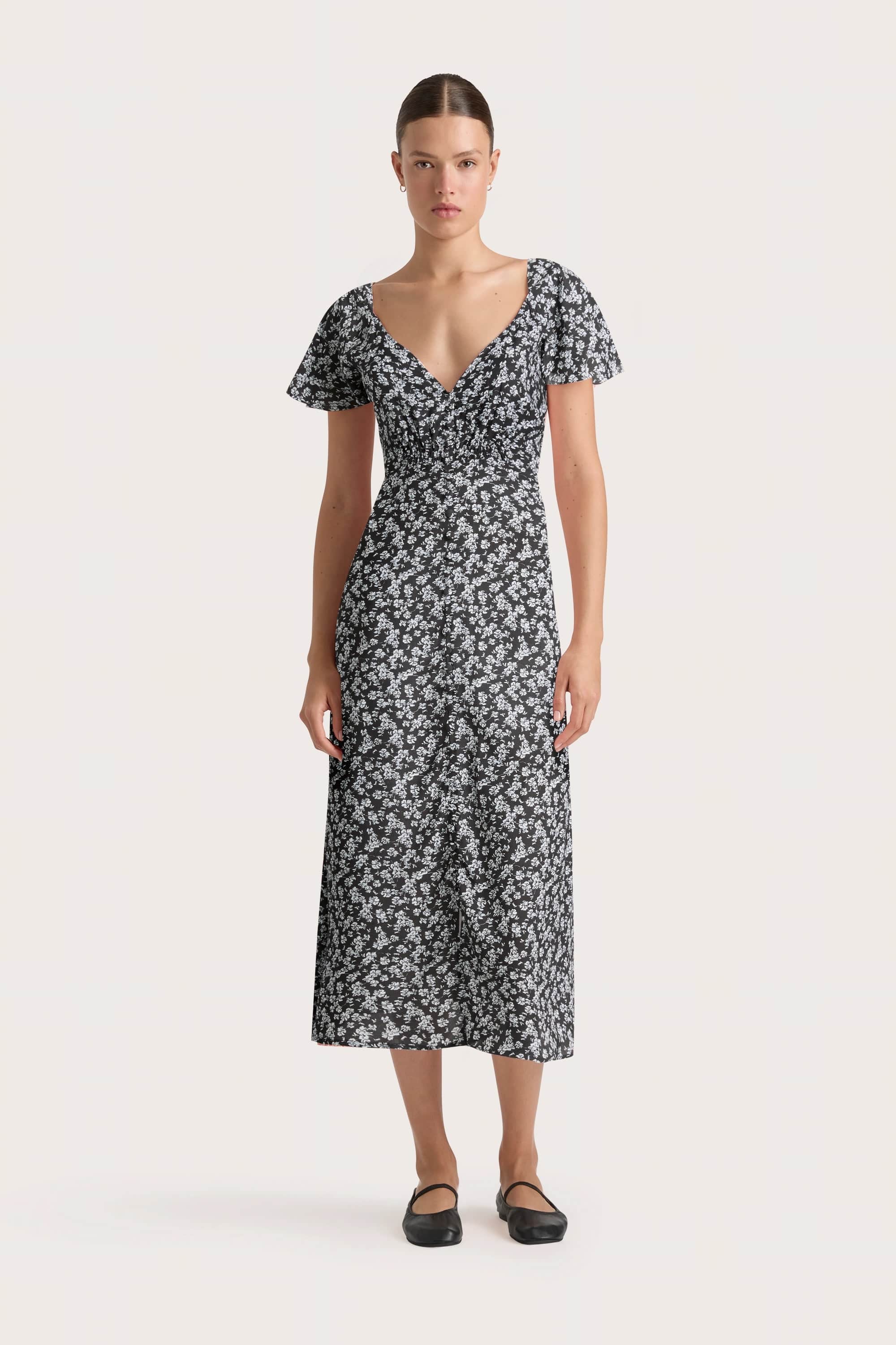 Midi dresses with bow accents for a sweet and charming look Aurelie Midi Dress Leilani Charred Navy - Final Sale Midi dresses with bow accents for a sweet and charming look Aurelie Midi Dress Leilani Charred Navy - Final Sale
