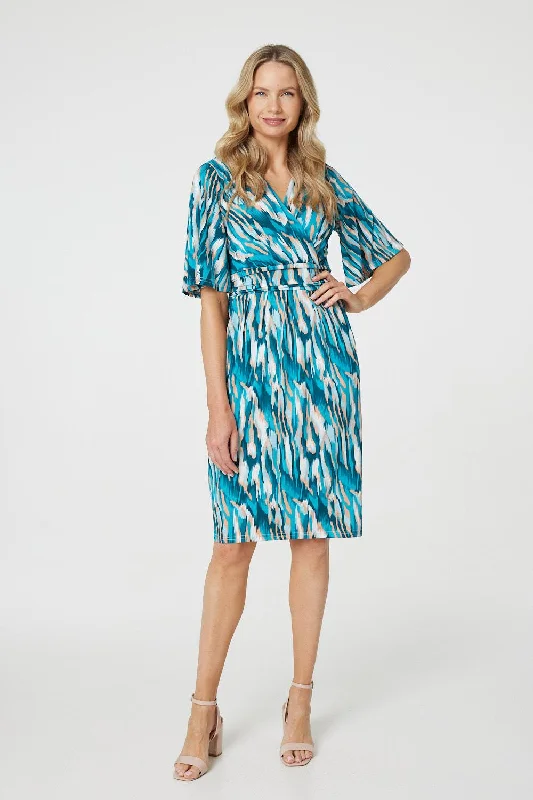 Midi dresses with fringe details for a fun and energetic style Printed 1/2 Angel Sleeve Faux Wrap Dress Midi dresses with fringe details for a fun and energetic style Printed 1/2 Angel Sleeve Faux Wrap Dress