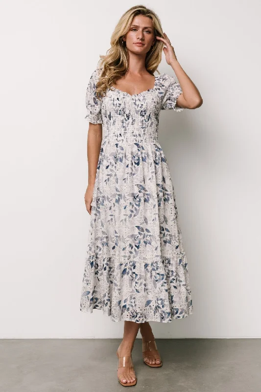 Midi dresses with fringe details for a fun and energetic style Piper Eyelet Midi Dress | Off White + Blue Floral Midi dresses with fringe details for a fun and energetic style Piper Eyelet Midi Dress | Off White + Blue Floral