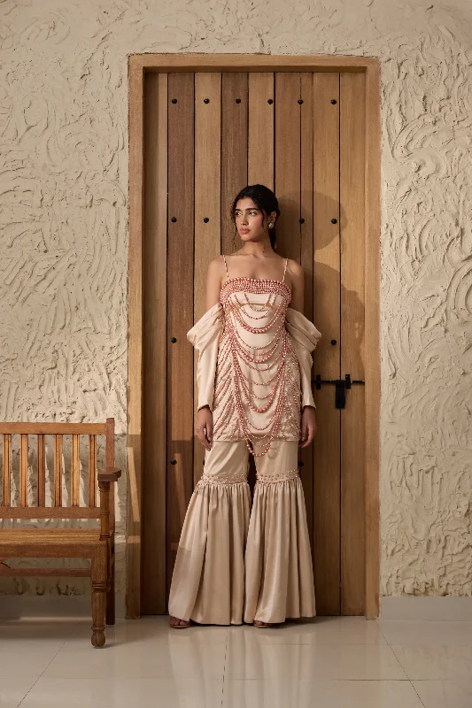 Holiday dresses with a pleated skirt and a button - down front for a timeless and classic holiday look Nadira Champagne Hand-Embroidered Sharara Set Holiday dresses with a pleated skirt and a button - down front for a timeless and classic holiday look Nadira Champagne Hand-Embroidered Sharara Set