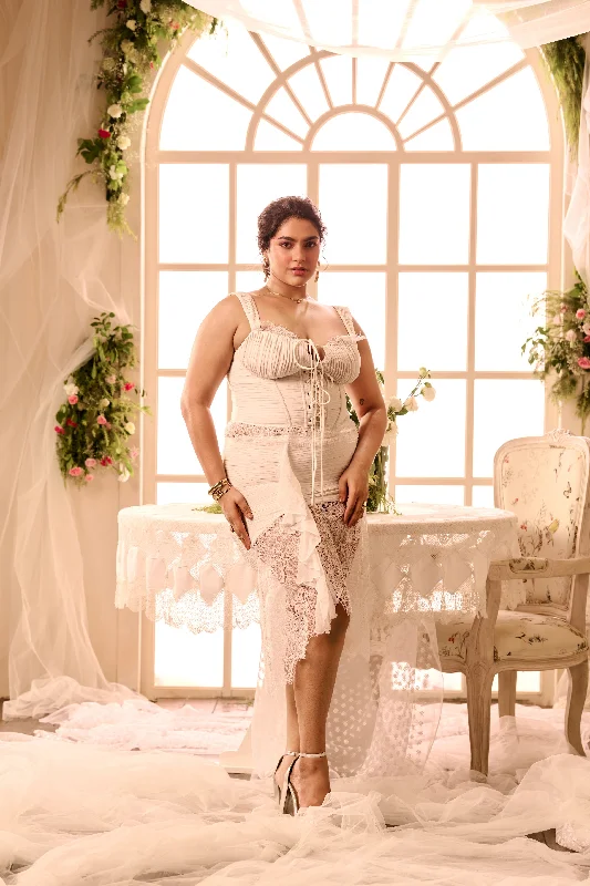 Holiday dresses with a tiered skirt and floral embroidery for a bohemian holiday vibe Medora White Tie-up Corset Top & Assymetrical Lace Skirt Set Holiday dresses with a tiered skirt and floral embroidery for a bohemian holiday vibe Medora White Tie-up Corset Top & Assymetrical Lace Skirt Set